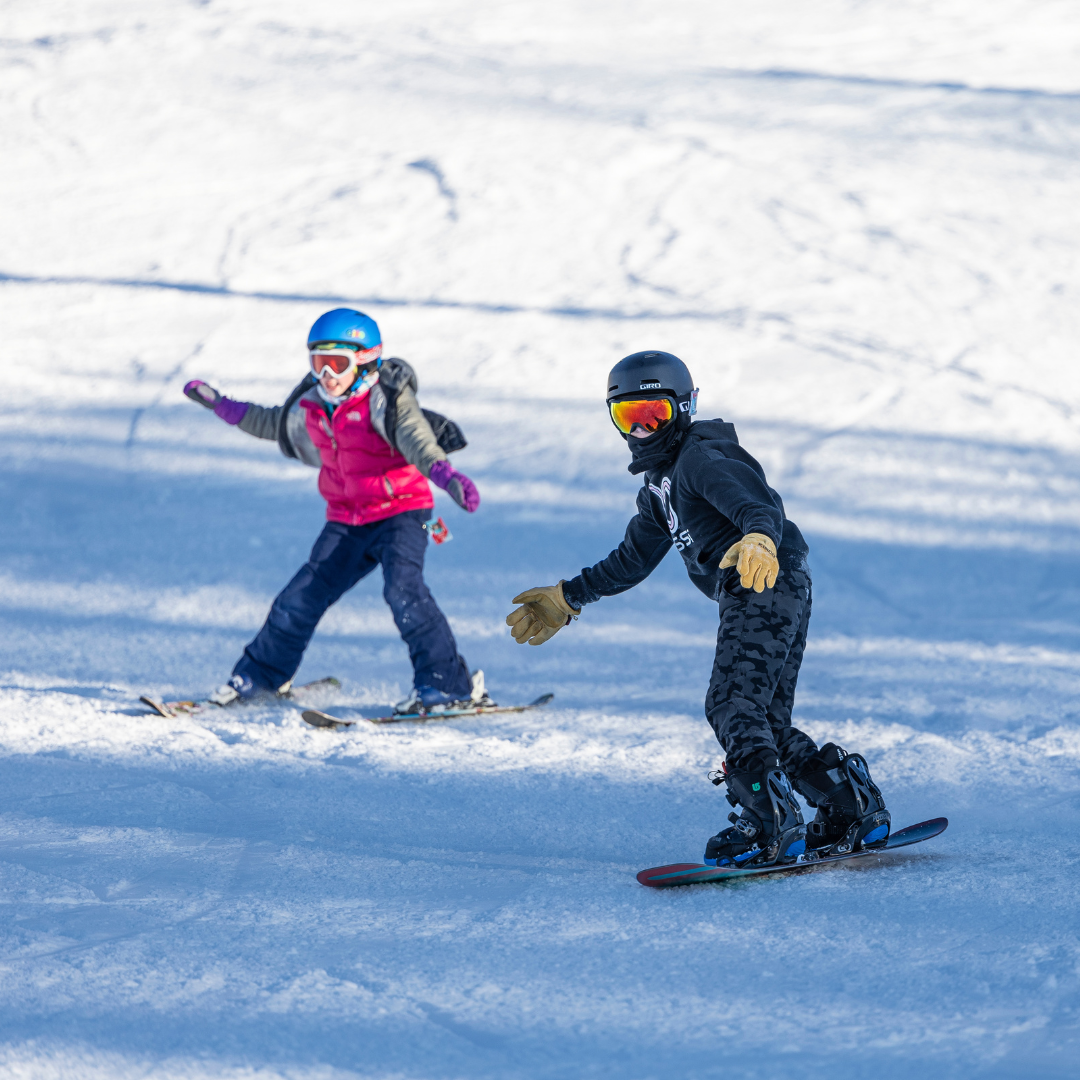 kids skiing down the hill
